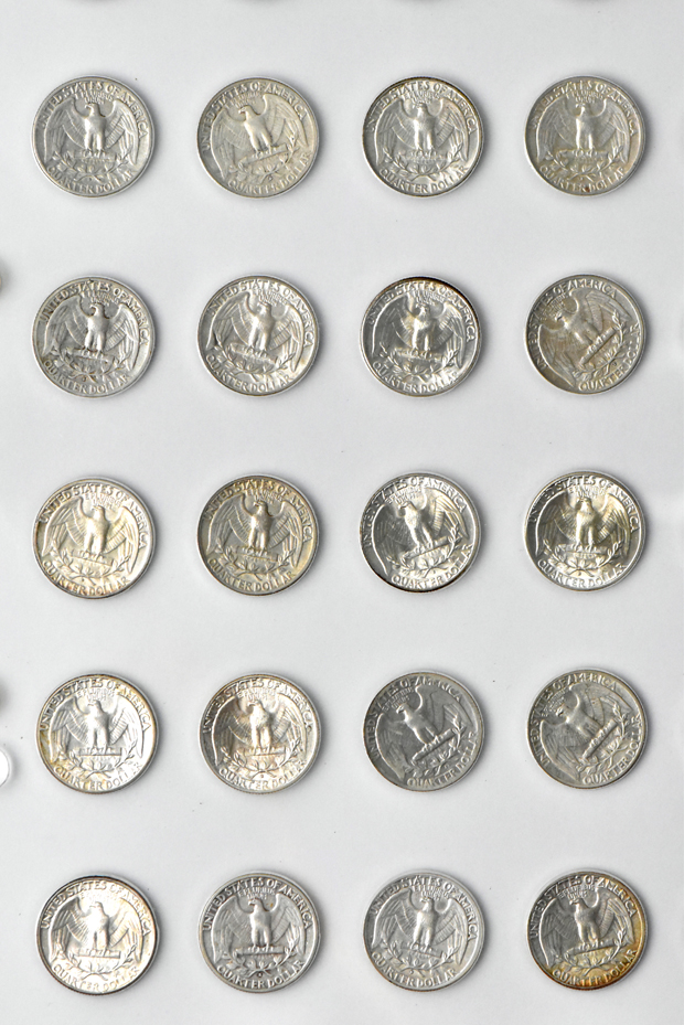 Collection of 72 different Washington quarters in a The National Coin Album