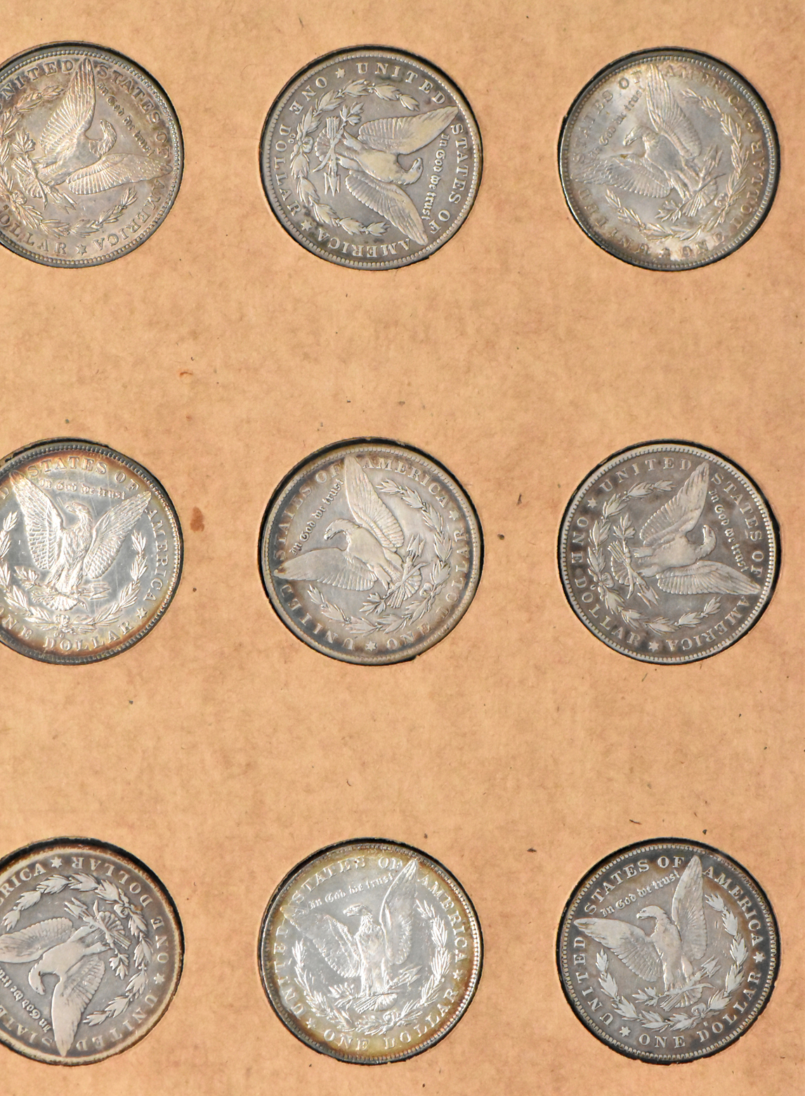 Collection of 50 different Morgan dollars in a The National Coin Album 