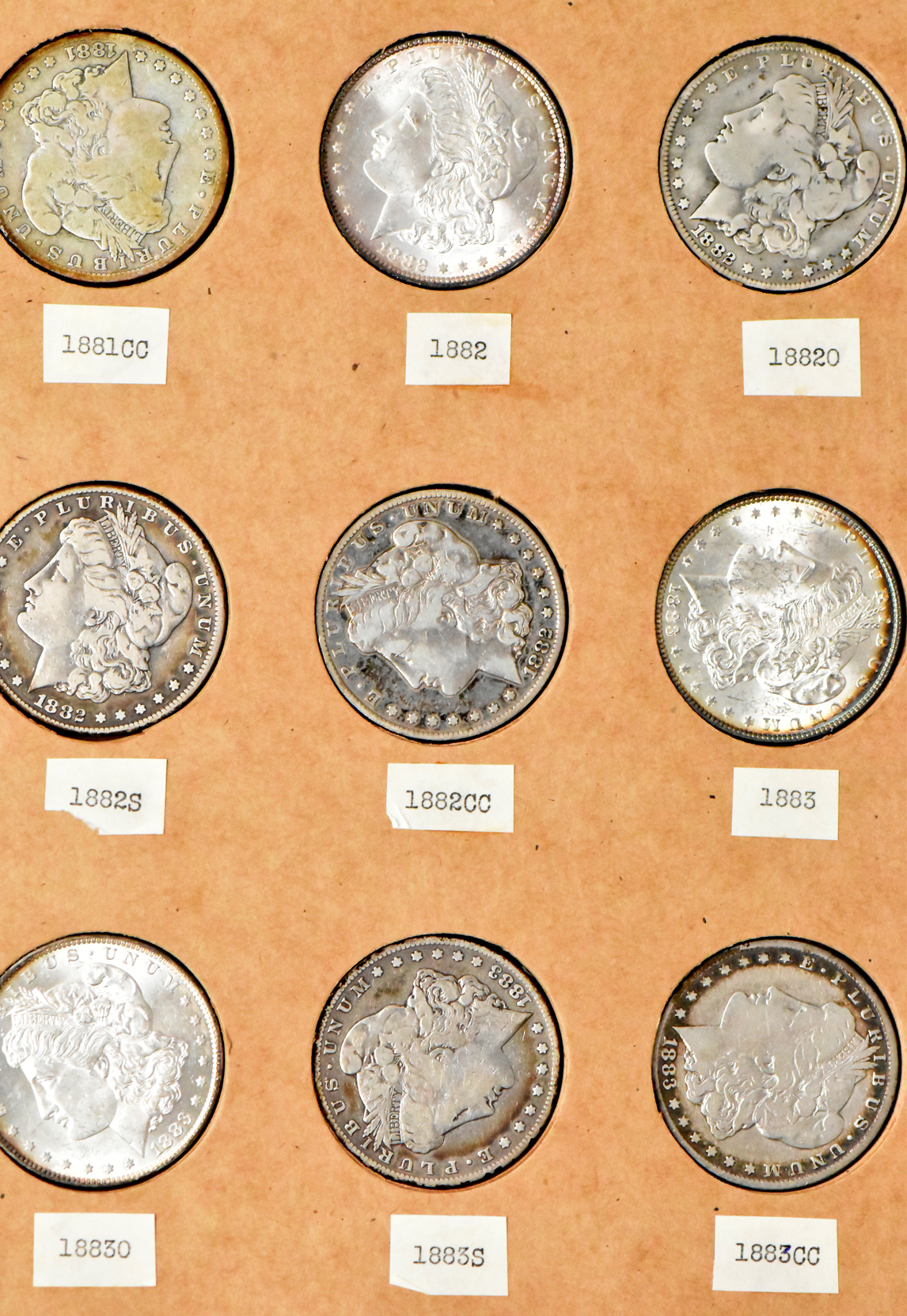 Collection of 50 different Morgan dollars in a The National Coin Album 