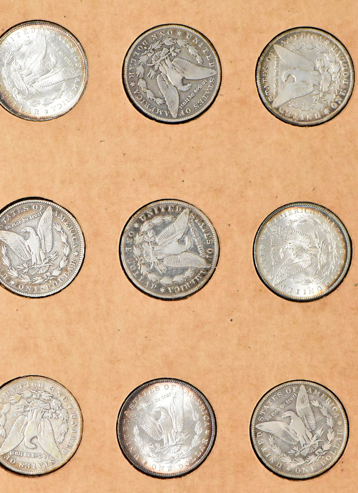 Collection of 50 different Morgan dollars in a The National Coin Album 