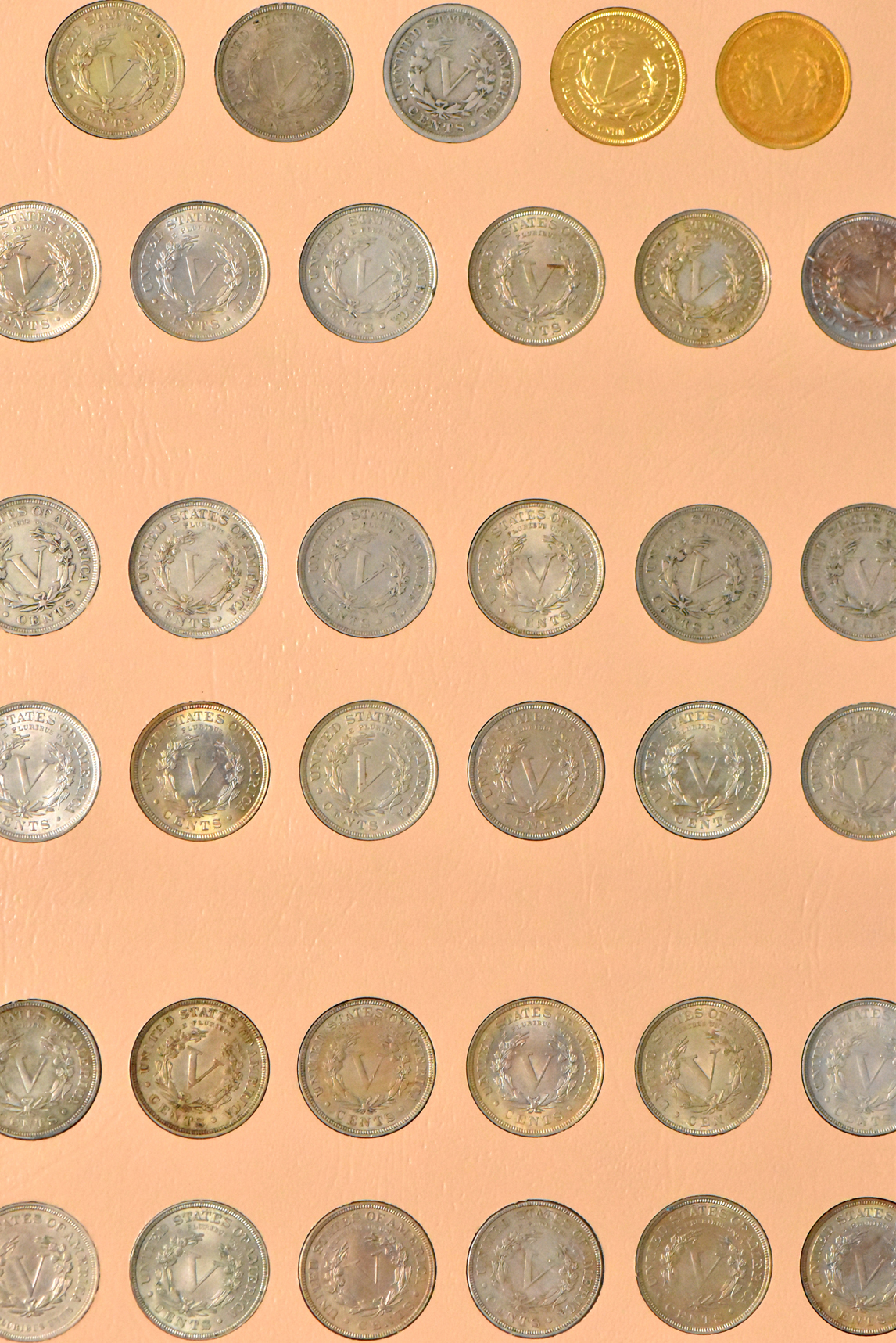 Collections of two-cent pieces, Shield nickels, and Liberty nickels in a Dansco album