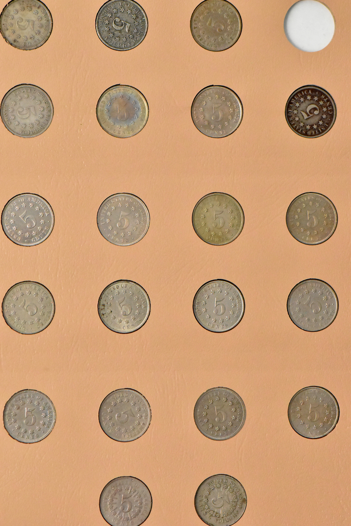 Collections of two-cent pieces, Shield nickels, and Liberty nickels in a Dansco album