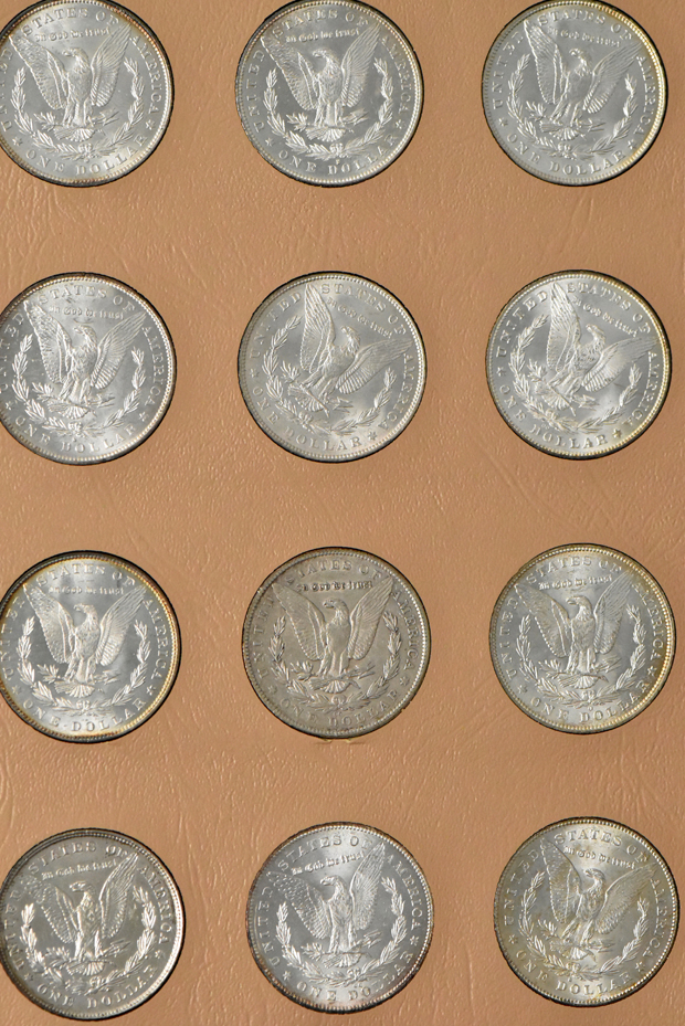 Collection of Morgan silver dollars, 1878 8TF through 1893-S, in a Dansco album