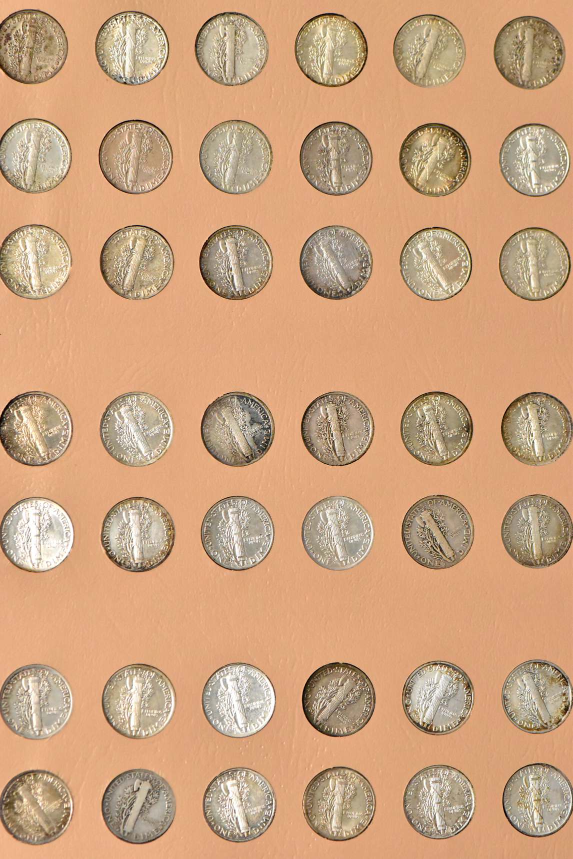 Collection of Mercury dimes, plus extras, in a complete Dansco 7123 album