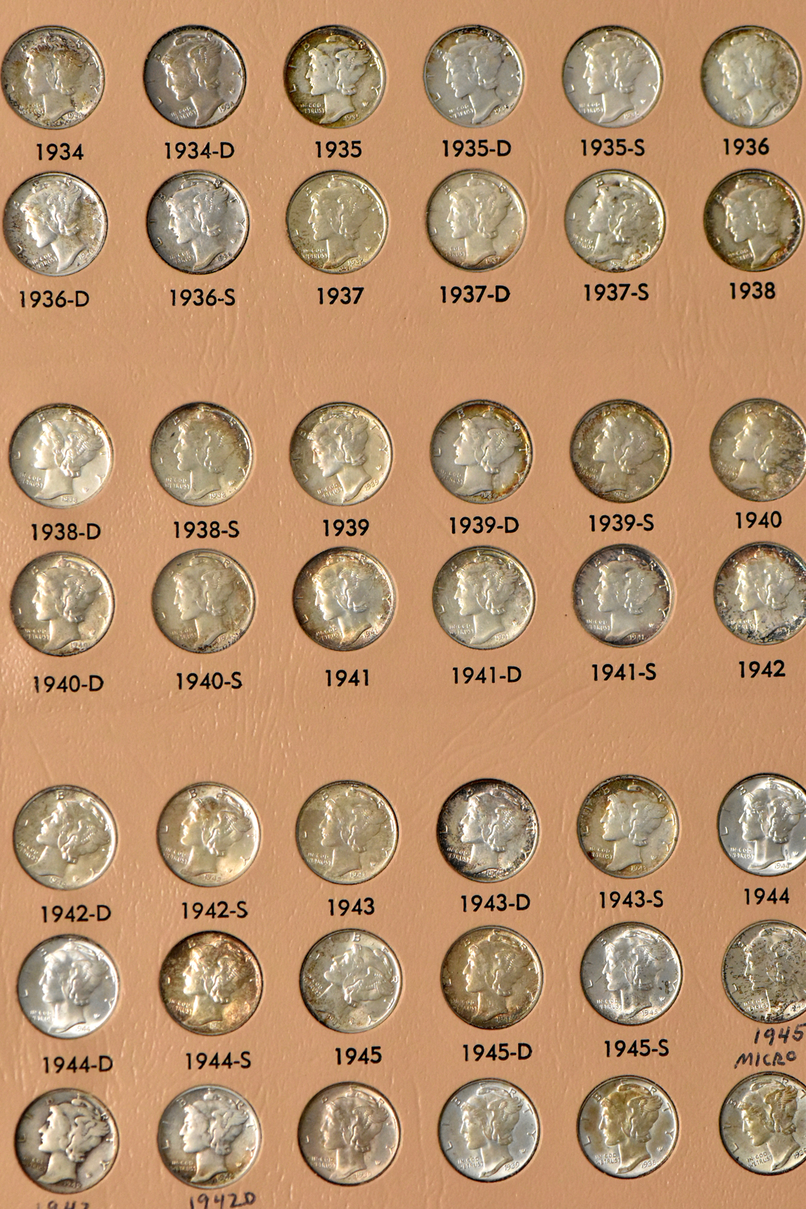 Collection of Mercury dimes, plus extras, in a complete Dansco 7123 album