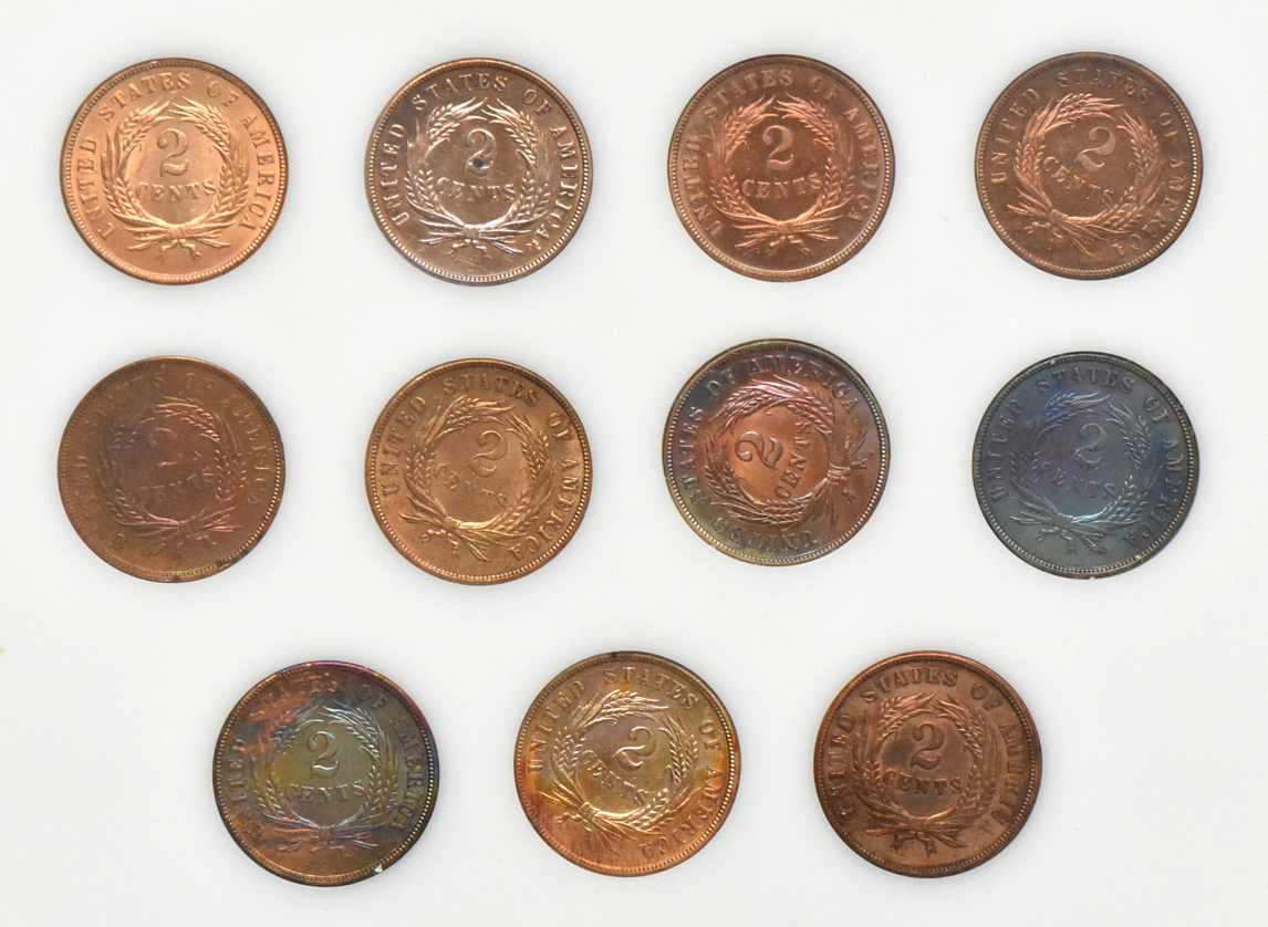 Collection of eleven different Two-Cent pieces, including two Proofs, in a Capital Plastics holder
