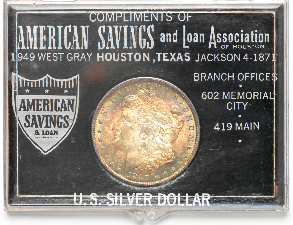 Four Morgan silver dollars.  One Redford, one Paramount, and two in American Savings & Loan cases