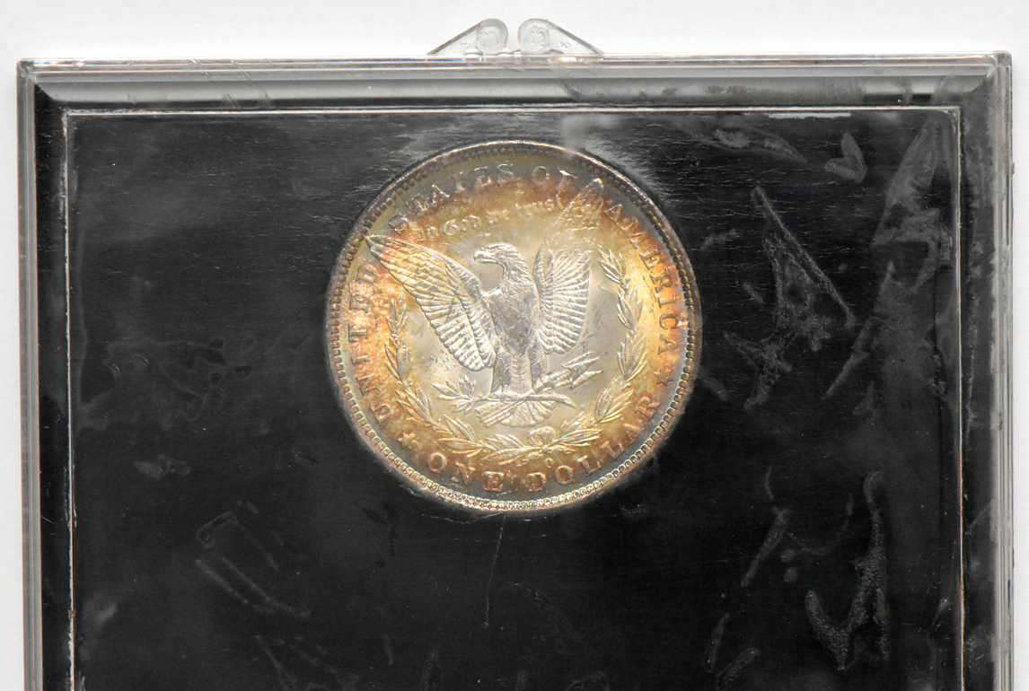 Four Morgan silver dollars.  One Redford, one Paramount, and two in American Savings & Loan cases