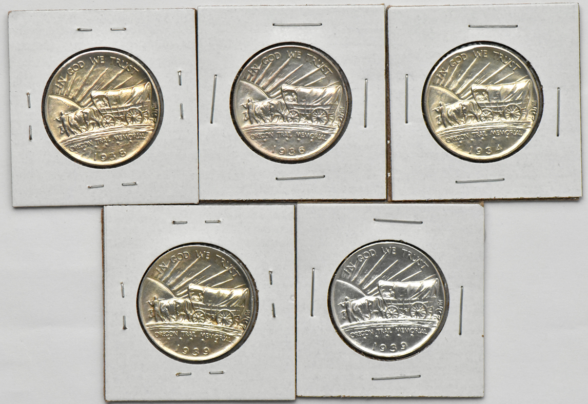 Five Oregon Trail silver commemorative half dollars