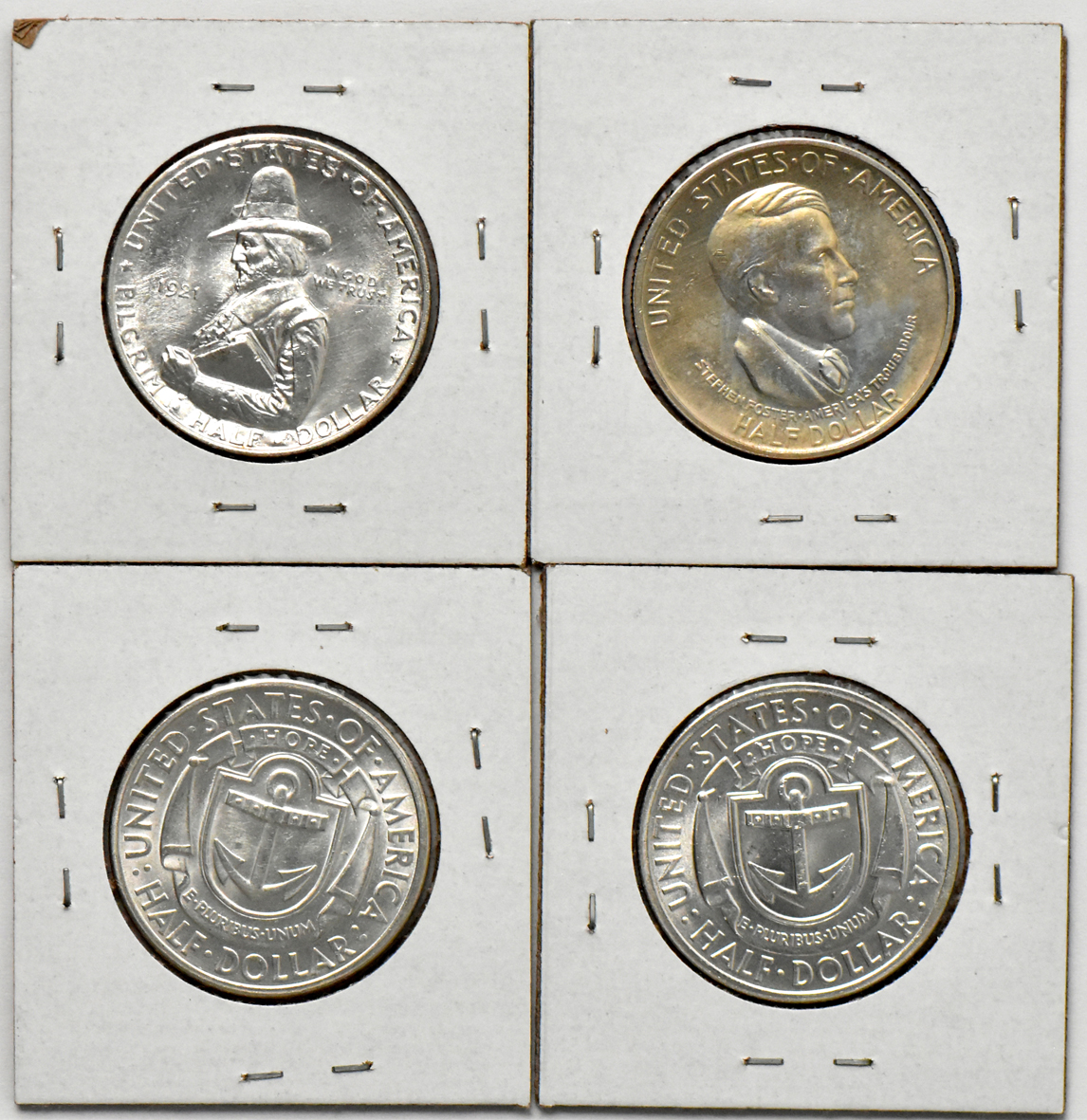 Four silver commemorative half dollars