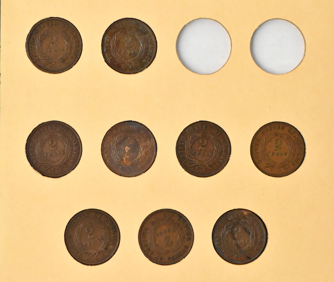 Half cents, two-cent pieces, three-cent nickels, and Shield nickels in two seperate Library of Coins albums