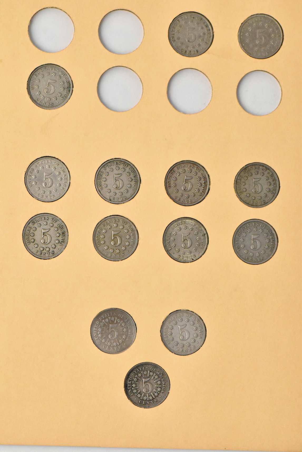 Half cents, two-cent pieces, three-cent nickels, and Shield nickels in two seperate Library of Coins albums