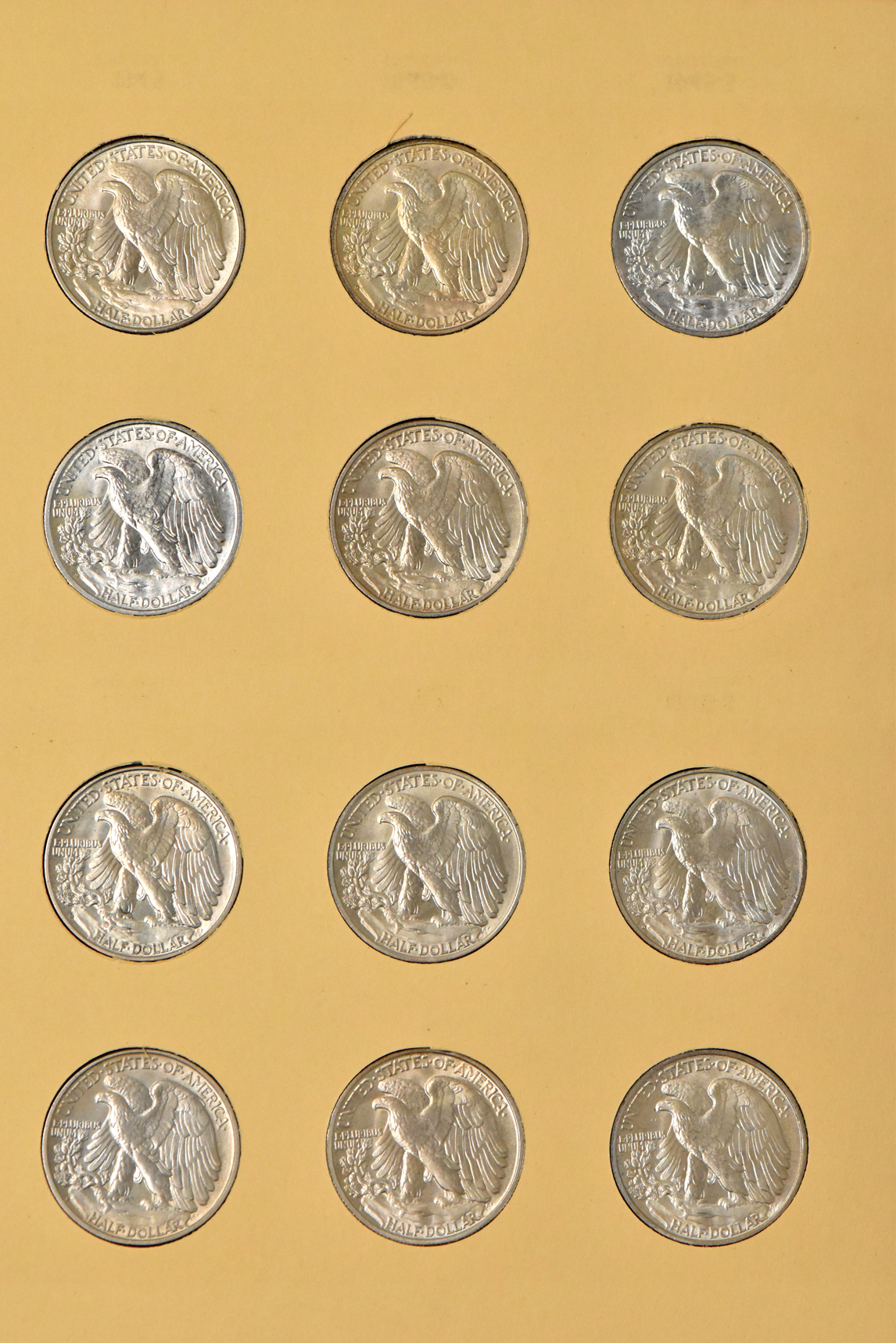Collection of Walking Liberty half dollars, 1937-D through 1947-D, in a complete Library of Coins Vol. 20 album