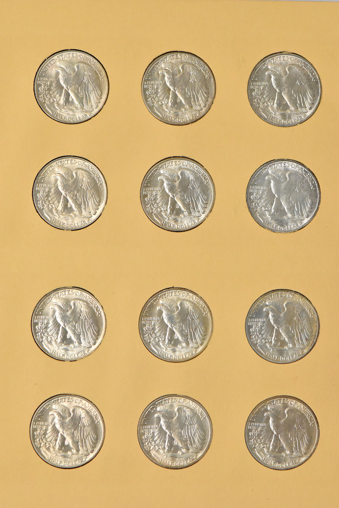 Collection of Walking Liberty half dollars, 1937-D through 1947-D, in a complete Library of Coins Vol. 20 album