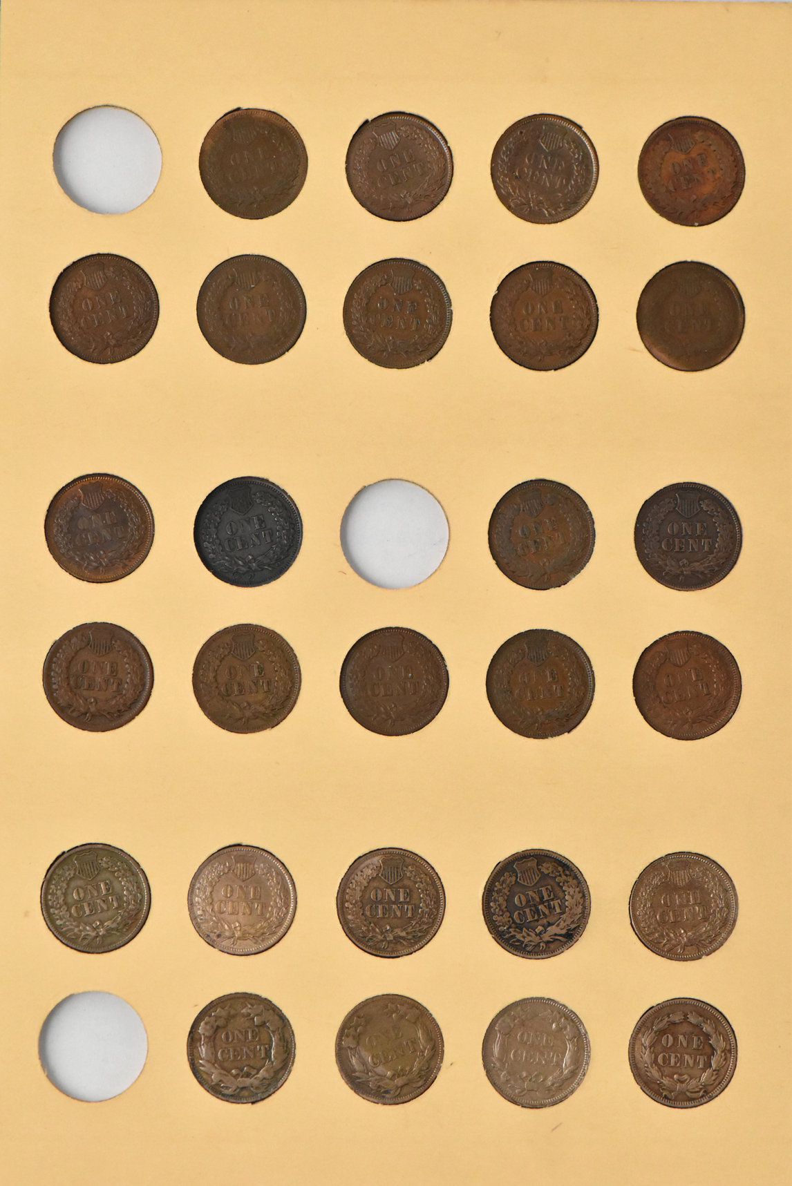 Three Flying Eagle cents and 51 Indian cents in a Library of Coins Vol. 1 album