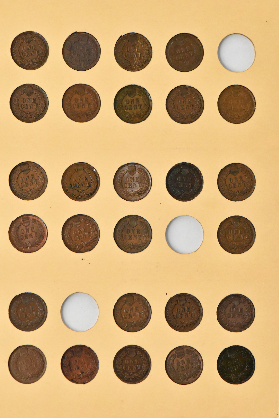 Three Flying Eagle cents and 51 Indian cents in a Library of Coins Vol. 1 album