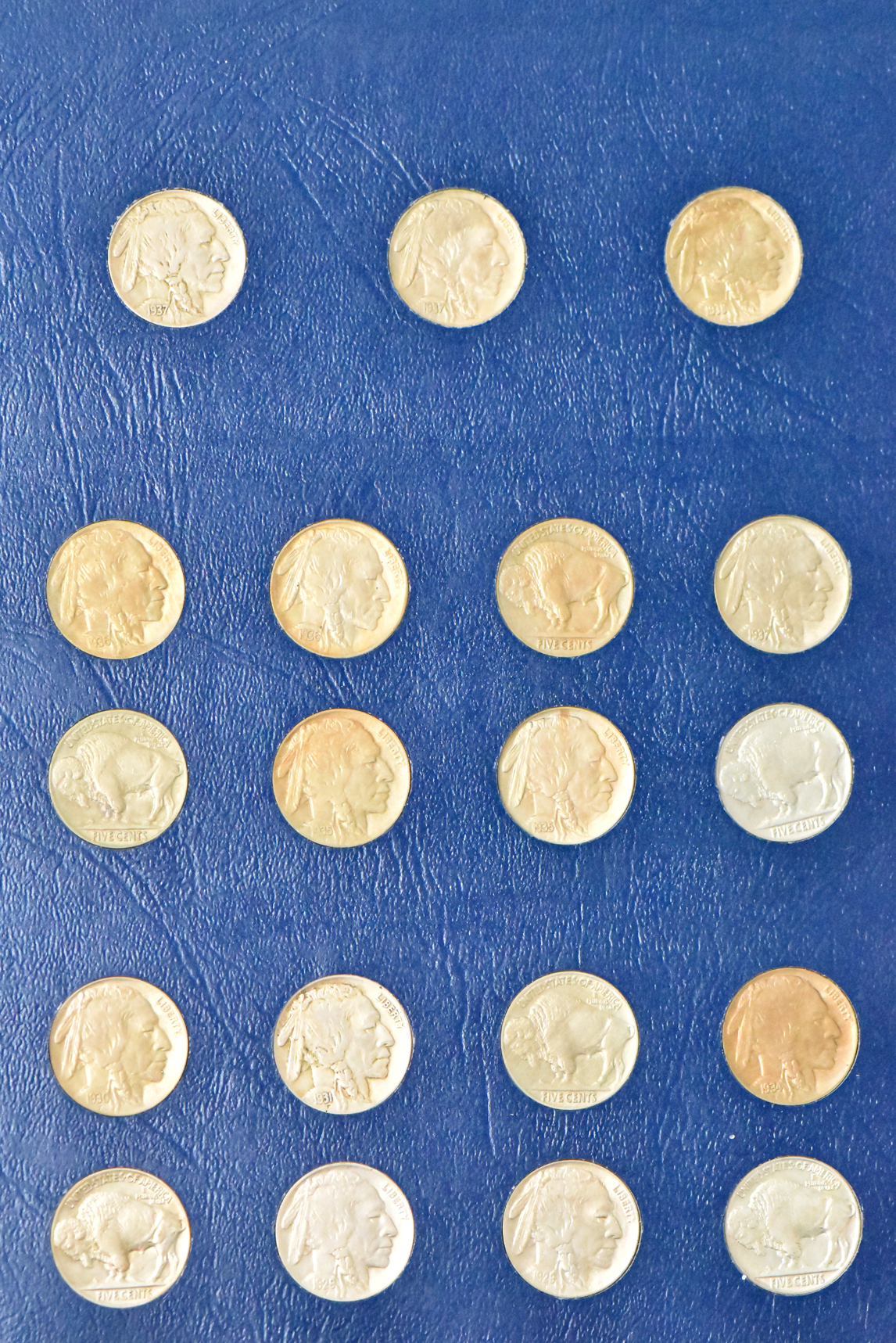 Collection of 65 different Buffalo nickels in a nearly complete Whitman 9403