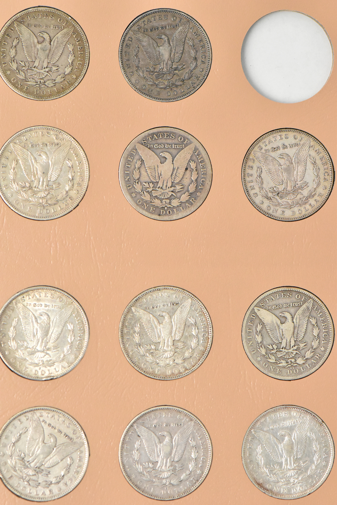 Collection of 42 Morgan dollars in a Dansco 7179 album