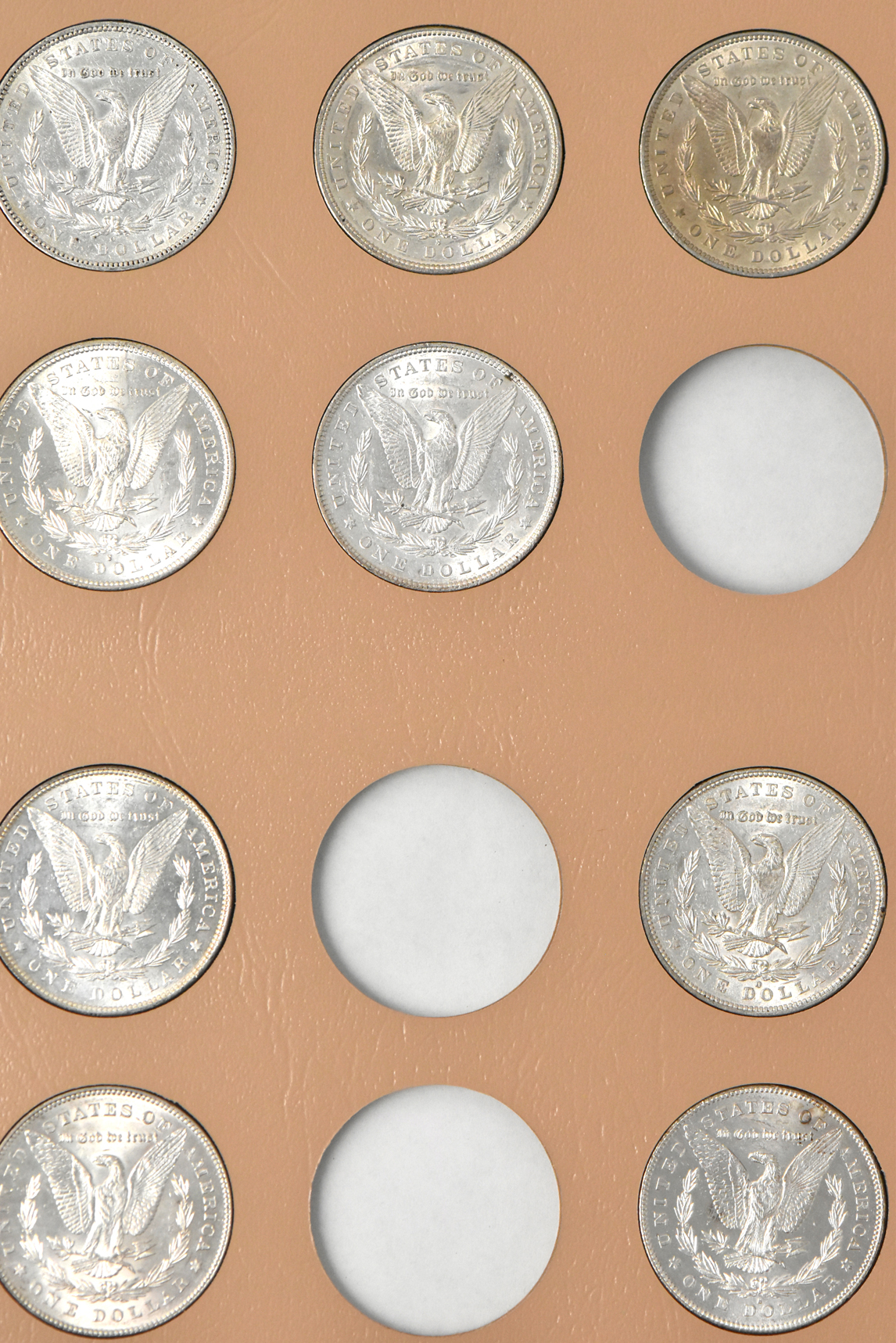 Collection of 38 different Morgan dollars in a Dansco 7178 album