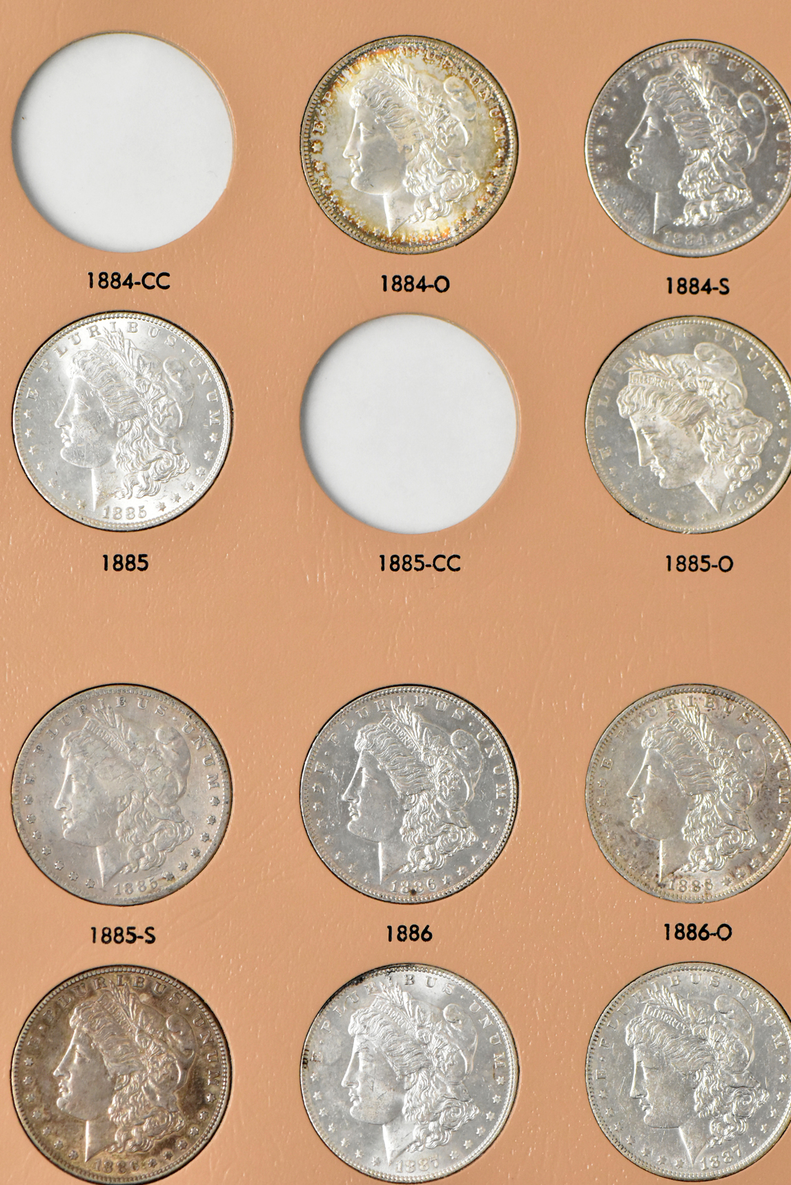 Collection of 38 different Morgan dollars in a Dansco 7178 album
