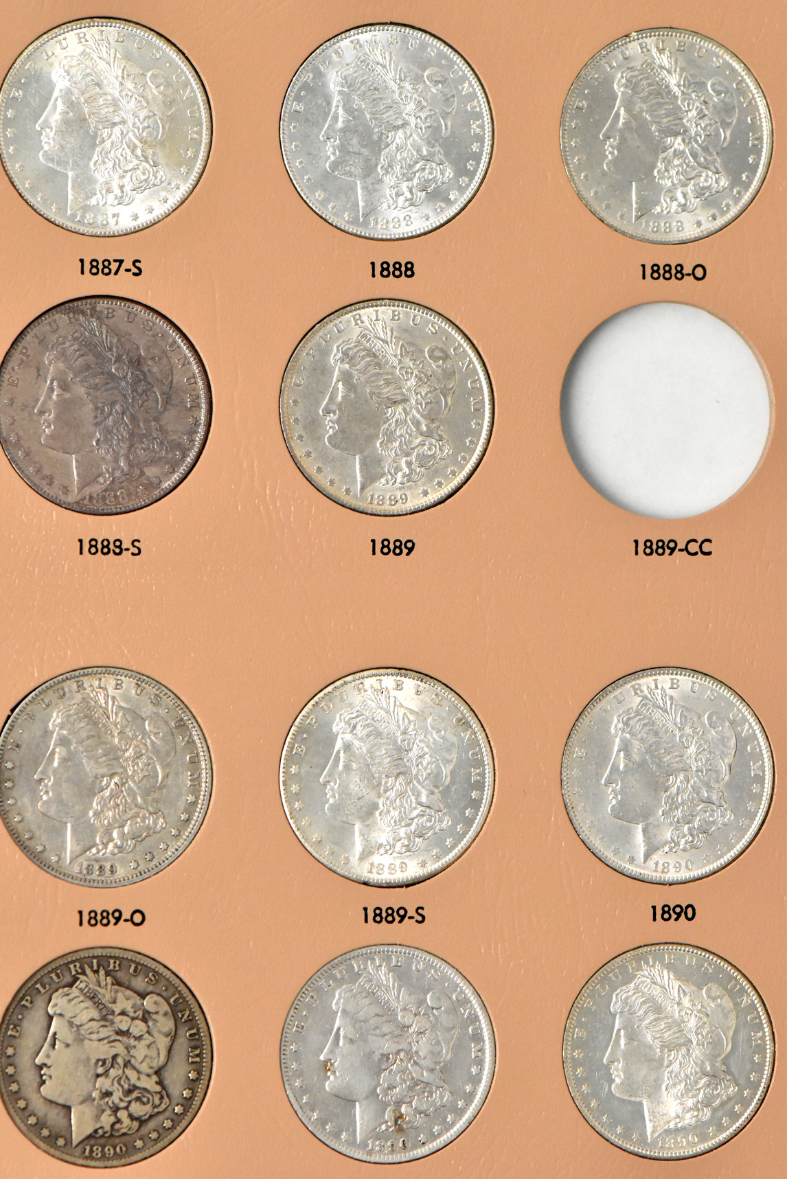 Collection of 38 different Morgan dollars in a Dansco 7178 album