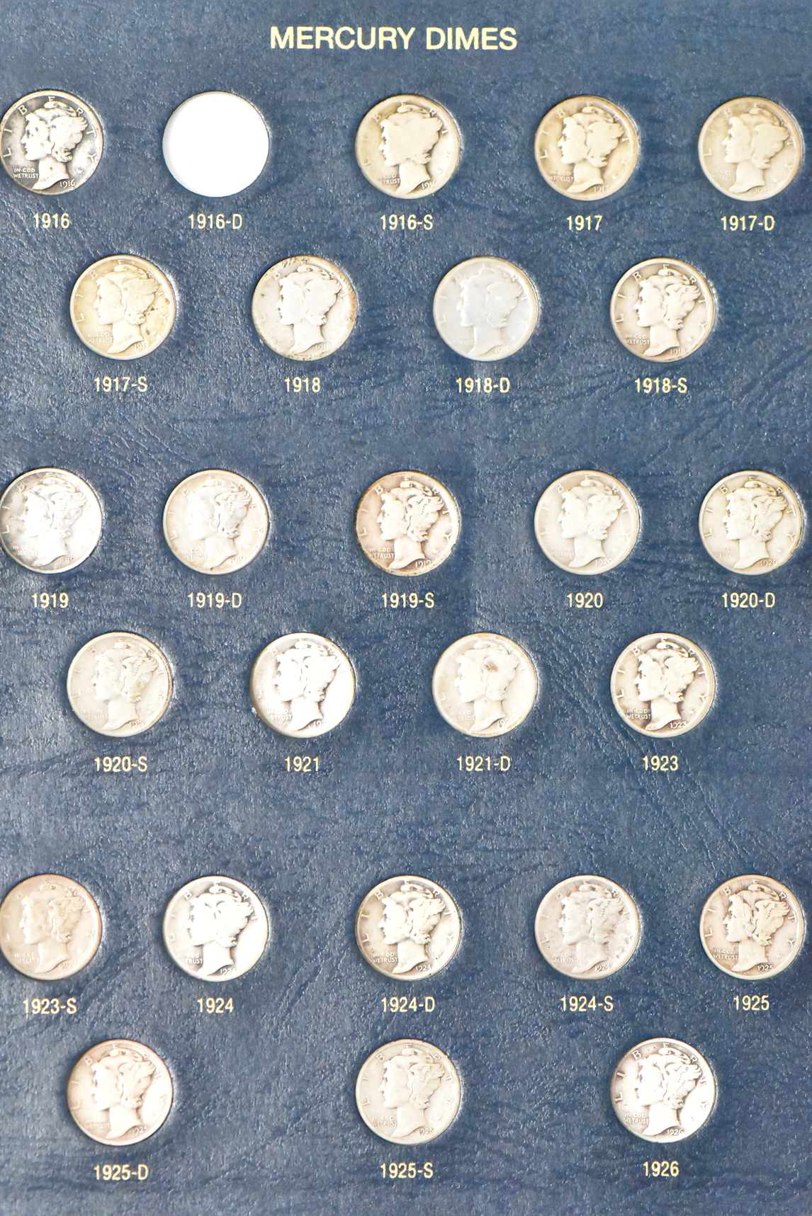 Collection of Mercury dimes complete save for the overdates in a Whitman 9118 album