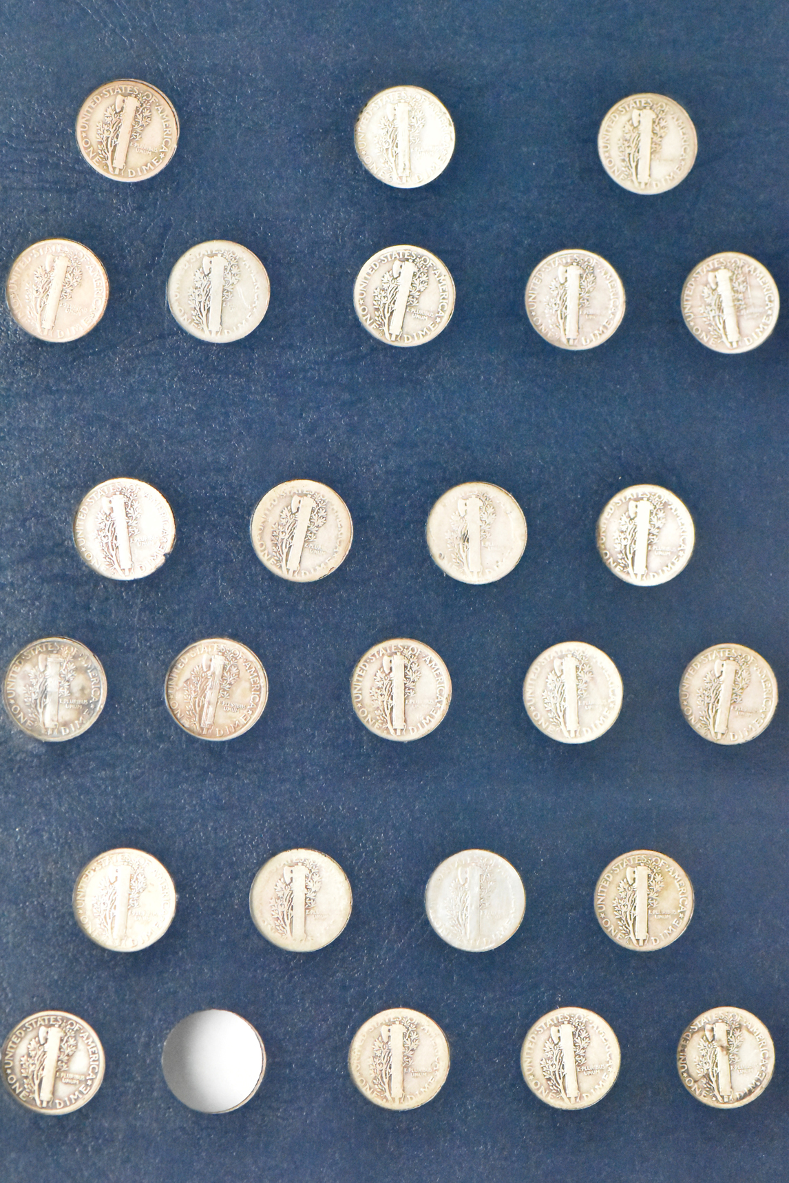 Collection of Mercury dimes complete save for the overdates in a Whitman 9118 album
