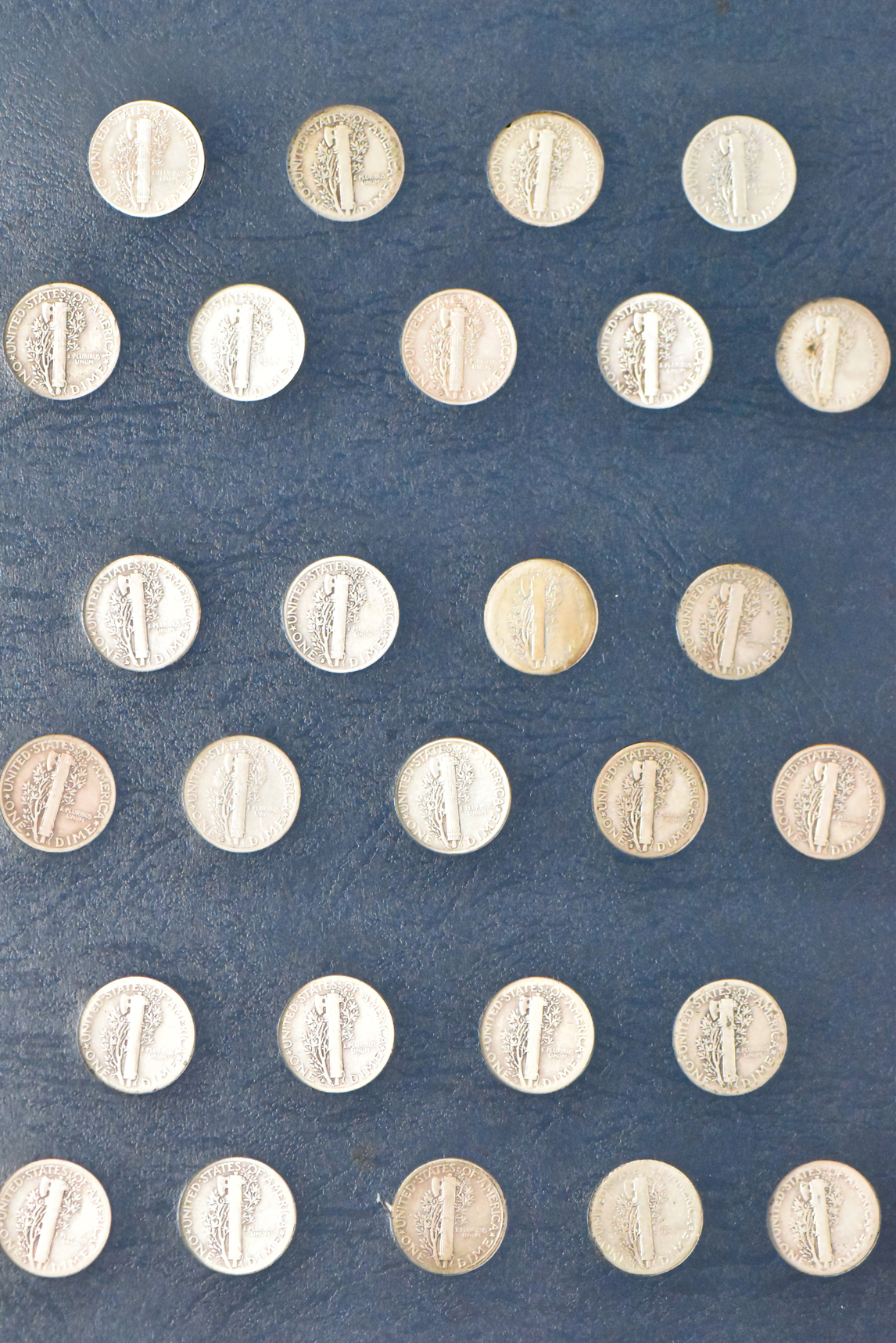 Collection of Mercury dimes complete save for the overdates in a Whitman 9118 album