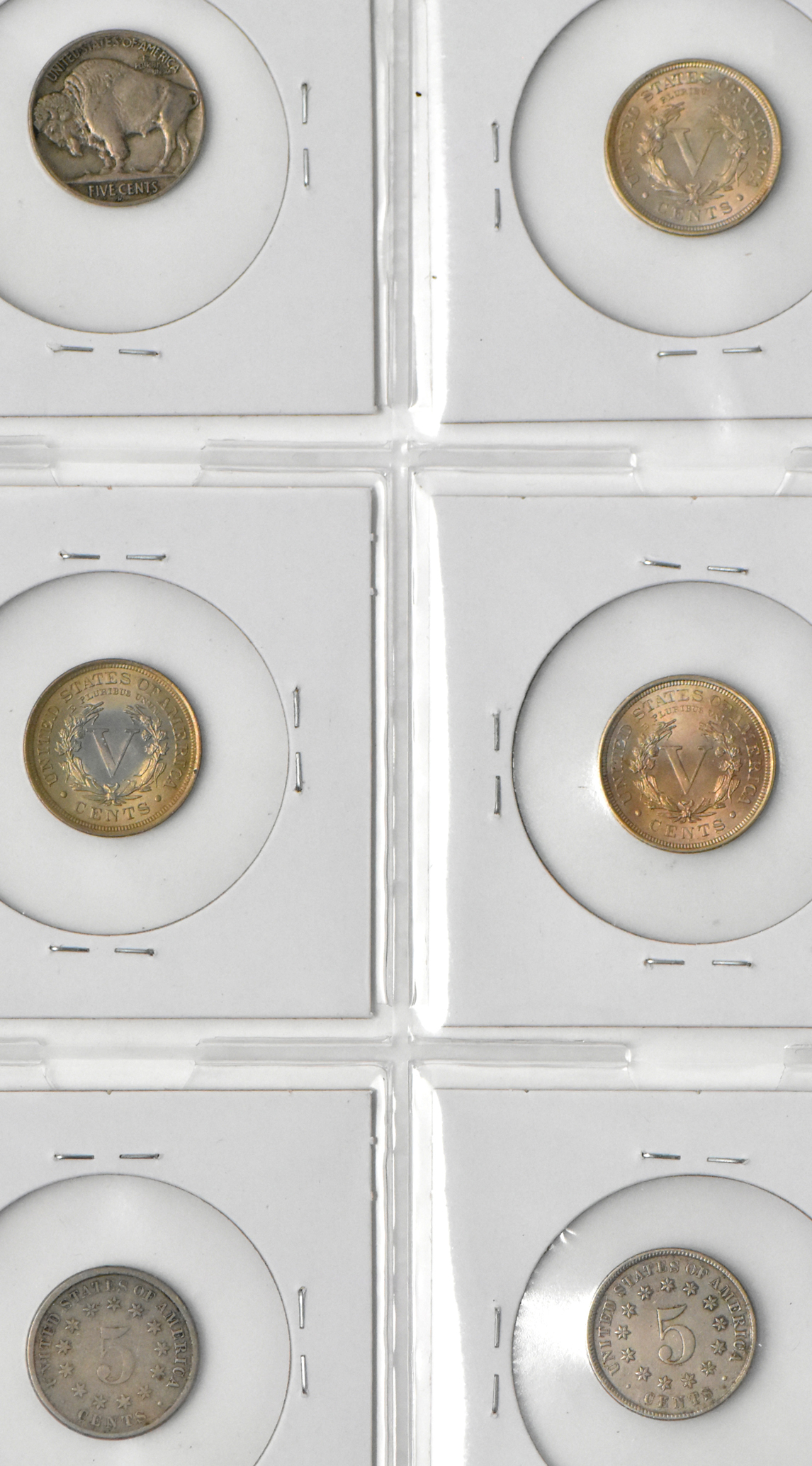Two Shield nickels, three Liberty nickels, and two Buffalo nickels