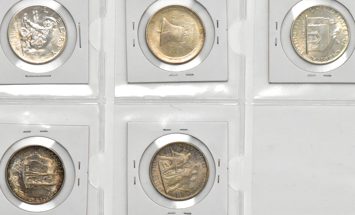Seven silver commemorative half dollars