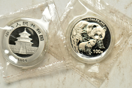 China - Two 2004 1/2oz Palladium Pandas, double sealed, with boxes and certificates