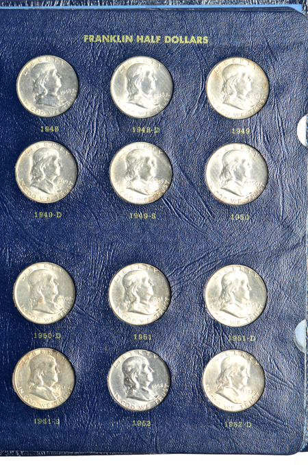 Two complete collections of Franklin half-dollars in Whitman albums