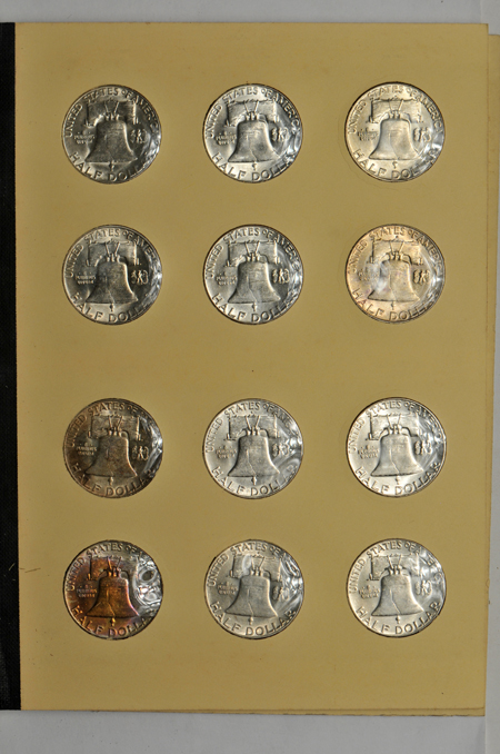 Collection of Franklin half-dollars and Roosevelt dimes in albums