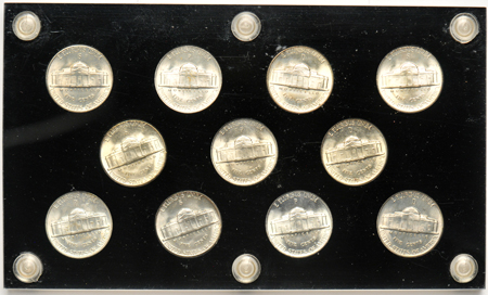 Collections of Franklin half-dollars, Roosevelt dimes, and War-Time nickels in Capital Plastics holders