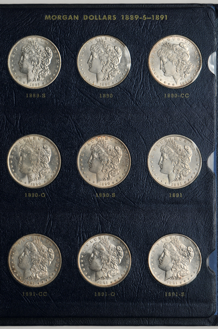 Collection of 33 different Morgan dollars in a Whitman 9428 album