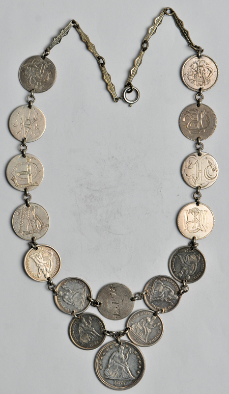 Love token group including three silver dollars and a necklace