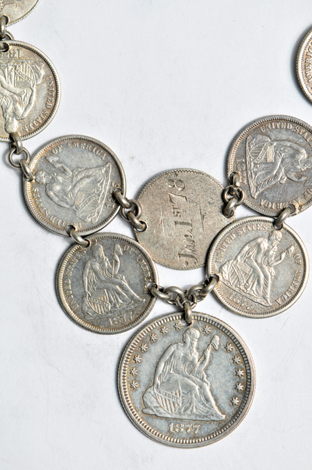 Love token group including three silver dollars and a necklace