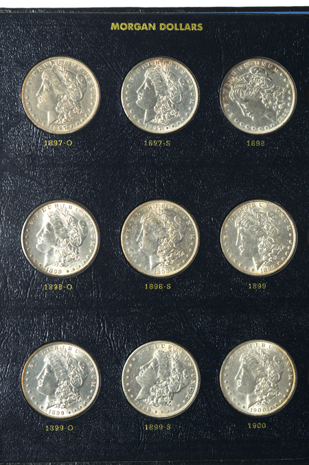 Thirty-one different Morgan silver dollars in a Whitman Classic 9129 album