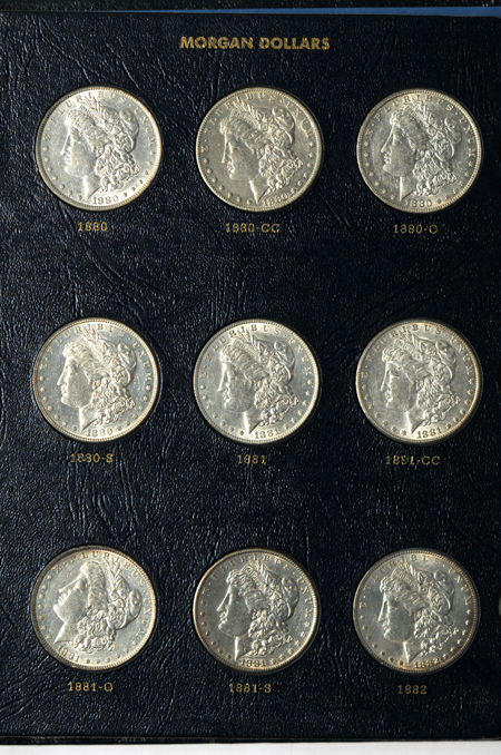 Fifty-one different Morgan silver dollars in a Whitman Classic 9128 album