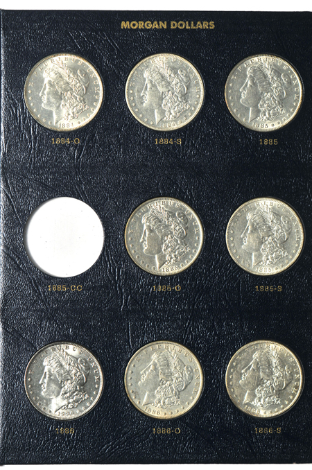Fifty-one different Morgan silver dollars in a Whitman Classic 9128 album