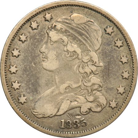 Four US quarter type coins