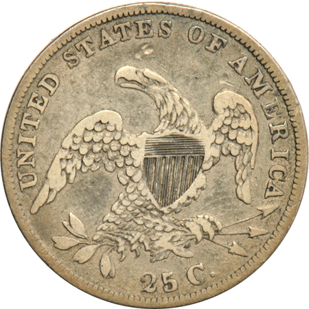 Four US quarter type coins