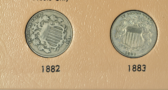 Collection of two-cent pieces, three-cent nickels, and Shield nickels in two Dansco albums