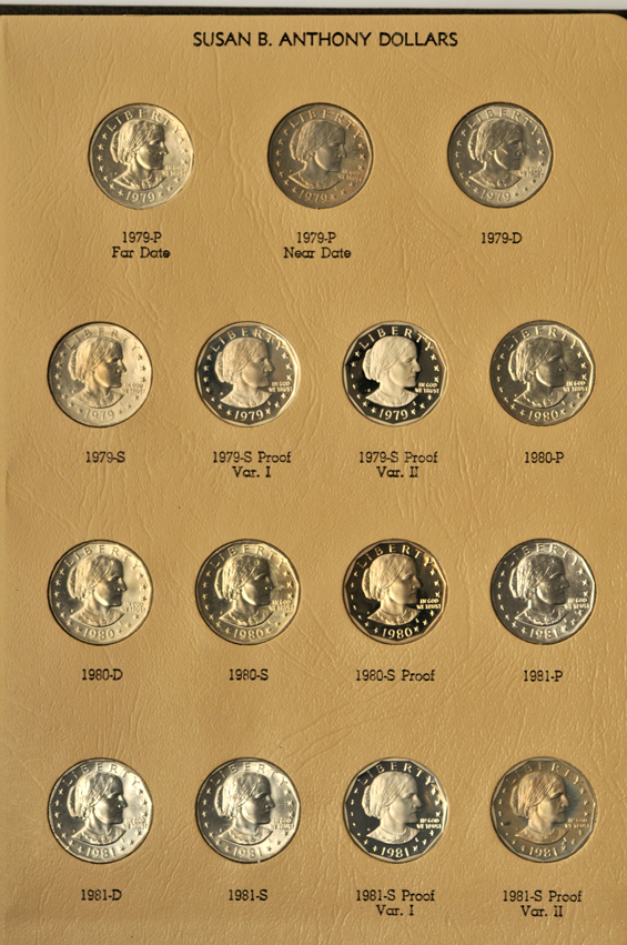 Four collections of Eisenhower dollars, two collections of Kennedy half-dollars, and a collection of SBA dollars in seven different albums
