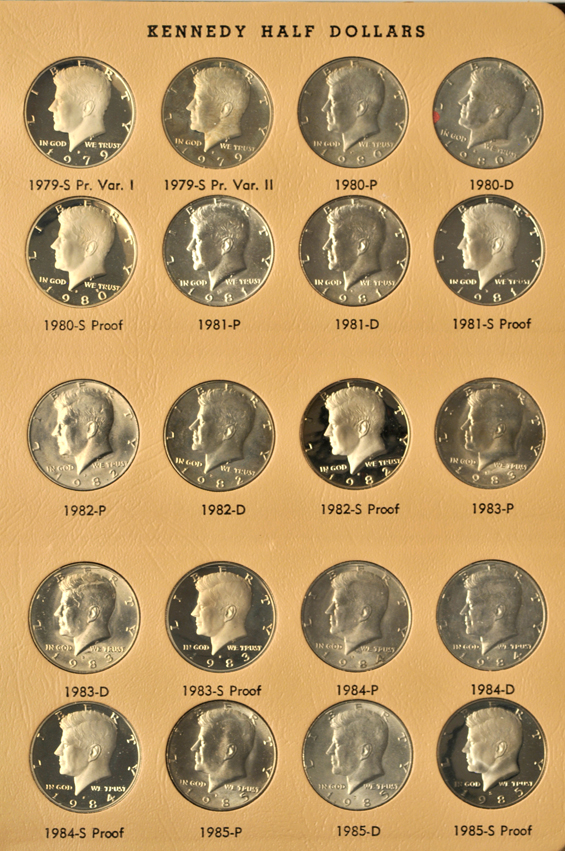 Four collections of Eisenhower dollars, two collections of Kennedy half-dollars, and a collection of SBA dollars in seven different albums