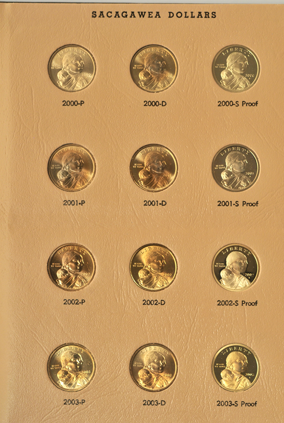 Partial collection of Kennedy half-dollars, plus collection of Jefferson nickels, SBA dollars, Sacajawea dollars, and Eisenhower dollars, in five albums