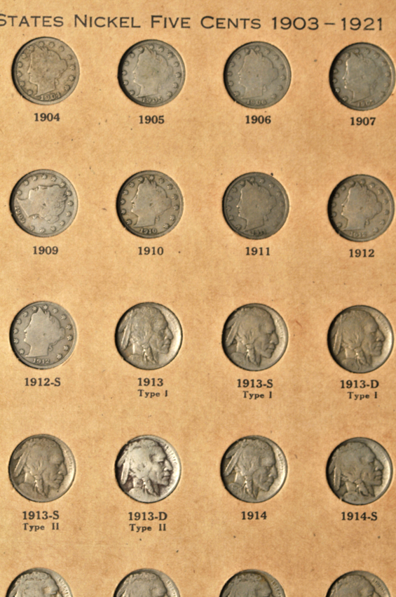 Collections of Flying Eagle cents, Indian Head cents, Lincoln cents, Liberty nickels, Buffalo nickels, and Jefferson nickels in two Wayte Raymond albums