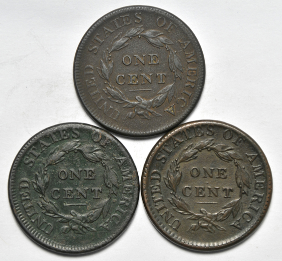 Five large cents, as described