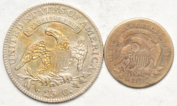 Four silver type coins, as described