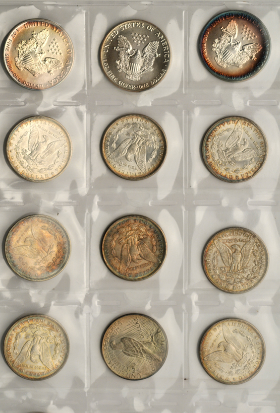 Twelve Morgan silver dollars, three Peace silver dollars, and seven American Silver Eagles
